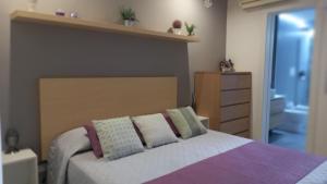 A bed or beds in a room at Villa Lilium