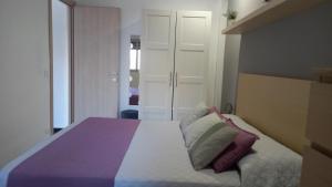A bed or beds in a room at Villa Lilium