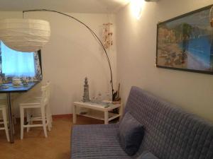 a living room with a couch and a table at Holiday in Sardinia in Santa Maria