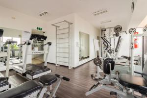 a gym with treadmills and elliptical machines at 360 Cerqueira César in Sao Paulo
