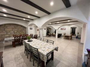 a dining room with a table and chairs at Lawendowa Stajnia in Lwówek Śląski