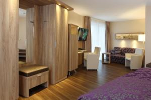 Postel nebo postele na pokoji v ubytování Hotel Simonshof