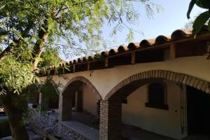 an external view of a house with arches at Casa Rustica Reserva Biosfera Tehuacan Cuicatlan 