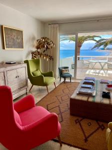 a living room with a view of the ocean at Sotogrande Paseo del Rio in Sotogrande