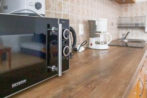 Kuchyňa alebo kuchynka v ubytovaní AL-DOM apartamenty Blue Olymp 203