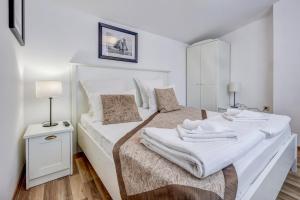 A bed or beds in a room at Just Studios