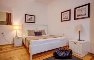 A bed or beds in a room at Just Studios