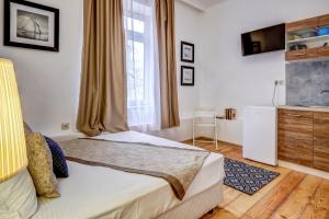A bed or beds in a room at Just Studios