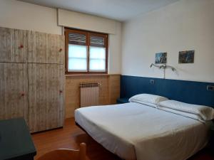 Voodi või voodid majutusasutuse Residence Biancaneve toas
