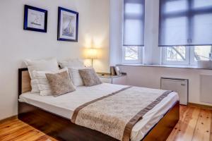 A bed or beds in a room at Just Studios