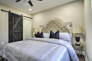 a bedroom with a large bed with a large headboard at Newark Rental Near University of Delaware! in Newark