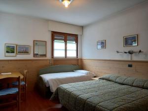 Voodi või voodid majutusasutuse Residence Biancaneve toas