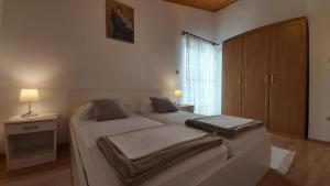 Postel nebo postele na pokoji v ubytování Apartman Vjeko
