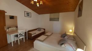 Postel nebo postele na pokoji v ubytování Apartman Vjeko