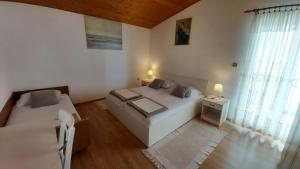 Postel nebo postele na pokoji v ubytování Apartman Vjeko