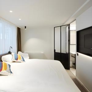 Voodi või voodid majutusasutuse Hotel Nelson toas