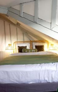 Postel nebo postele na pokoji v ubytování Gite Les Lanternes