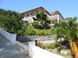 a house with a garden in front of it at IJEOMA HOUSE in Bequia