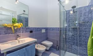 a bathroom with a sink and a toilet and a shower at B&B Mazzini in Alba Adriatica