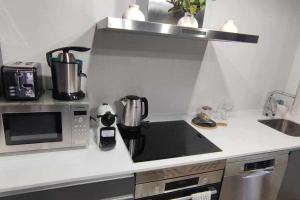 Kuchnia lub aneks kuchenny w obiekcie Precioso Apartamento 2 Hab con Bañera Hidromasaje