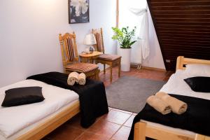 a bedroom with two beds and a table and chairs at Agropex in Lublin