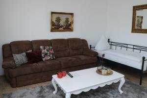a living room with a couch and a coffee table at Aparthotel Kompass A 301 in Essen