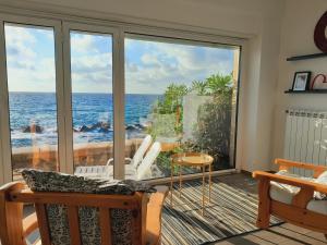 a room with a view of the ocean at Marina Holiday Home in Pizzo