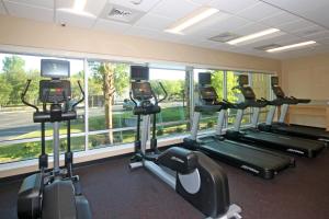 a row of tread machines in a gym with a window at TownePlace Suites by Marriott Charleston-North Charleston in Charleston