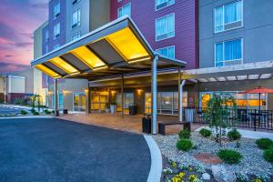 an exterior view of a building with a canopy at TownePlace Suites by Marriott Cookeville in Cookeville