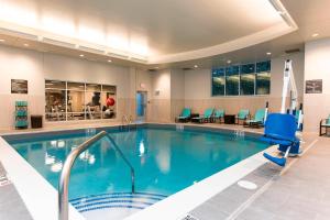 a swimming pool in a hotel lobby with a pool at Residence Inn by Marriott Ann Arbor Downtown in Ann Arbor