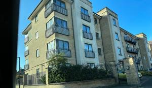 an apartment building with balconies on the side of it at Stylish 2 Bed Apartment Derby in Derby
