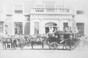 an old photo of a horse drawn carriage in front of a building at The Shelbourne, Autograph Collection in Dublin