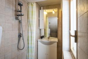 a bathroom with a sink and a shower at Monolocale - Rosa sea view in villa in Santa Cesarea Terme +15 photos