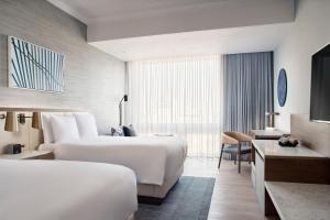 Postel nebo postele na pokoji v ubytování JW Marriott Hotel Mexico City Polanco