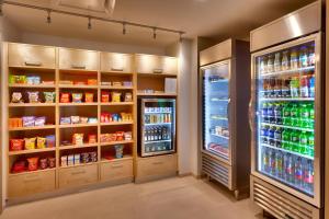 a kitchen with two refrigerators and a refrigerator at Residence Inn by Marriott Flagstaff in Flagstaff