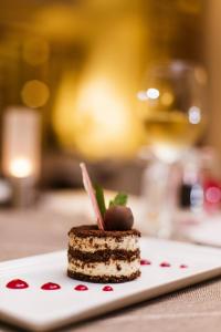 a piece of cake on a plate on a table at Prive Hotel Bodrum - Adult Only in Bodrum City