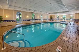 a large swimming pool in a hotel room at Fairfield by Marriott Russellville in Russellville