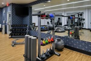 a gym with a lot of equipment at Four Points by Sheraton Kansas City Olathe in Olathe