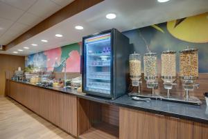 a restaurant with a counter with wine glasses at Fairfield Inn by Marriott Burlington Williston in Burlington