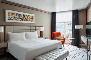 a bedroom with a bed and a desk and a chair at London Marriott Hotel County Hall in London