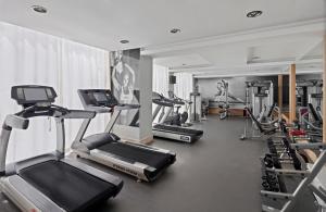 a gym with several treadmills and cardio machines at Prive Hotel Bodrum - Adult Only in Bodrum City