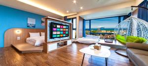 Televizorius ir (arba) pramogų centras apgyvendinimo įstaigoje 漫遊小旅泳池溫泉宅 Roaming Travel Hot Spring Homestay