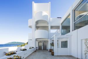a white house with a view of the ocean at Prive Hotel Bodrum - Adult Only in Bodrum City