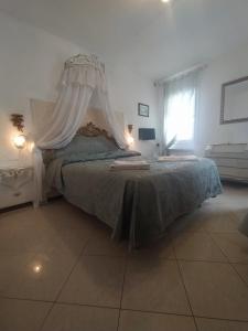 a bedroom with a large bed with a canopy at Cà Isabella in Venice