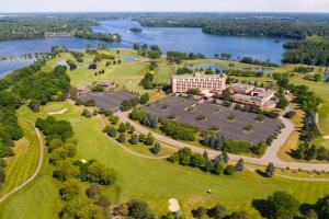 an aerial view of a resort with a large building and a river at Ann Arbor Marriott Ypsilanti at Eagle Crest in Ann Arbor