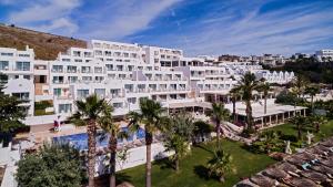 an aerial view of a hotel with palm trees at Prive Hotel Bodrum - Adult Only in Bodrum City