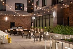 a patio with tables and chairs and lights at Residence Inn Walnut Creek in Walnut Creek