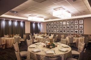 a banquet room with tables and chairs and pictures on the walls at Fairfield Inn and Suites Chicago Downtown-River North in Chicago