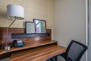 a room with a desk with a lamp and a chair at Fairfield Inn and Suites Chicago Downtown-River North in Chicago