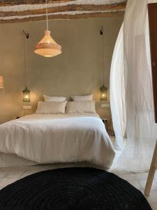 Postel nebo postele na pokoji v ubytování Hostal Aljibe